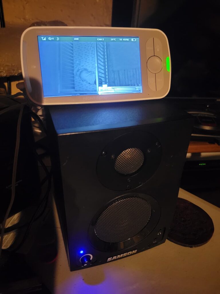 picture of a studio monitor with a baby monitor on top of it