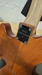 photograph of RF40 custom partscaster's custom engraved neck plate